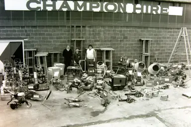 Champion Hire directors Keith and Derek in front of the whole champion hire plant range in the 1980s